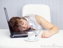 young-woman-comically-asleep-keyboard-table-12796881.jpg