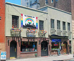 Stonewall_Inn_2012_with_gay-pride_flags_and_banner.jpg