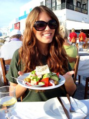 greek food girl holding salad with feta.jpg
