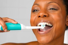 A+close+up+of+someone+using+their+electric+tooth+brush.jpg