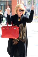Joan river gives middle finger.jpg