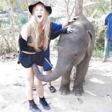 Funny blonde with baby elephant.jpg