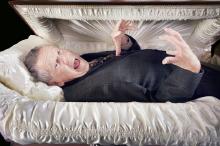 A-Man-Alive-And-Laying-In-A-Coffin.jpg