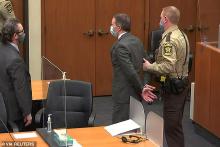 Chauvin in hand cuffs off to ass ra.jpg