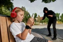 boy-use-smartphone-near-sly-pedophi.jpg