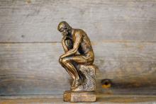 the-thinker-small-statue-wood-backg.jpg