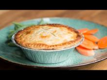 Chicken pot pie in foil on plate.jpg